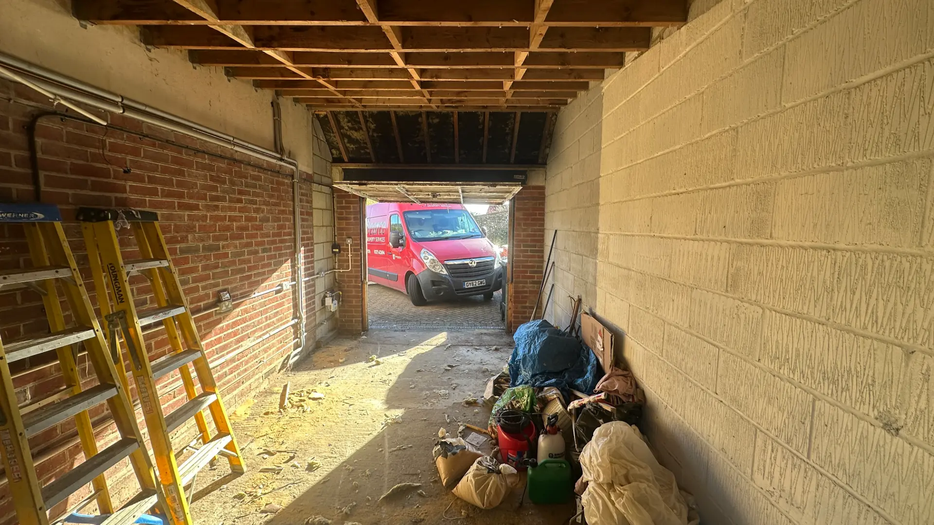 Before — Mile Oak garage stripped back ready for conversion
